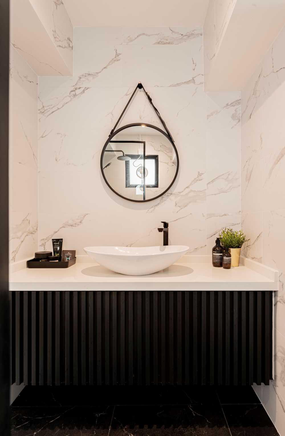 minimalist bathroom with countertop and mirror
