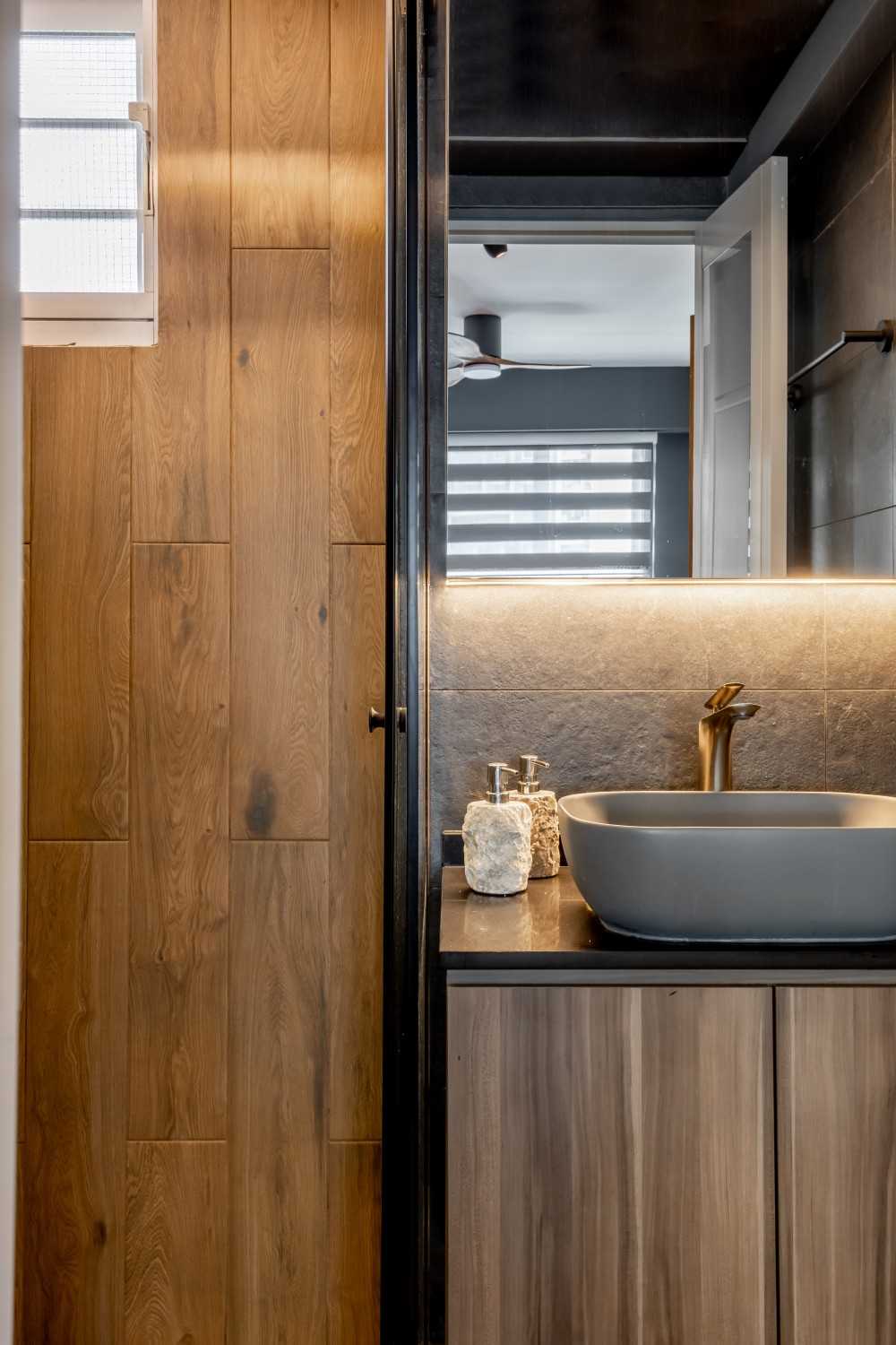 modern bathroom with countertop and wood flooring