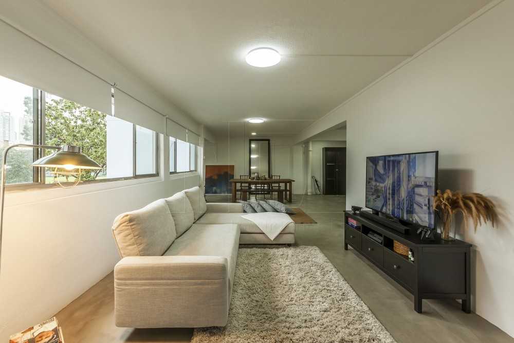 contemporary living room with cement floor and tv console