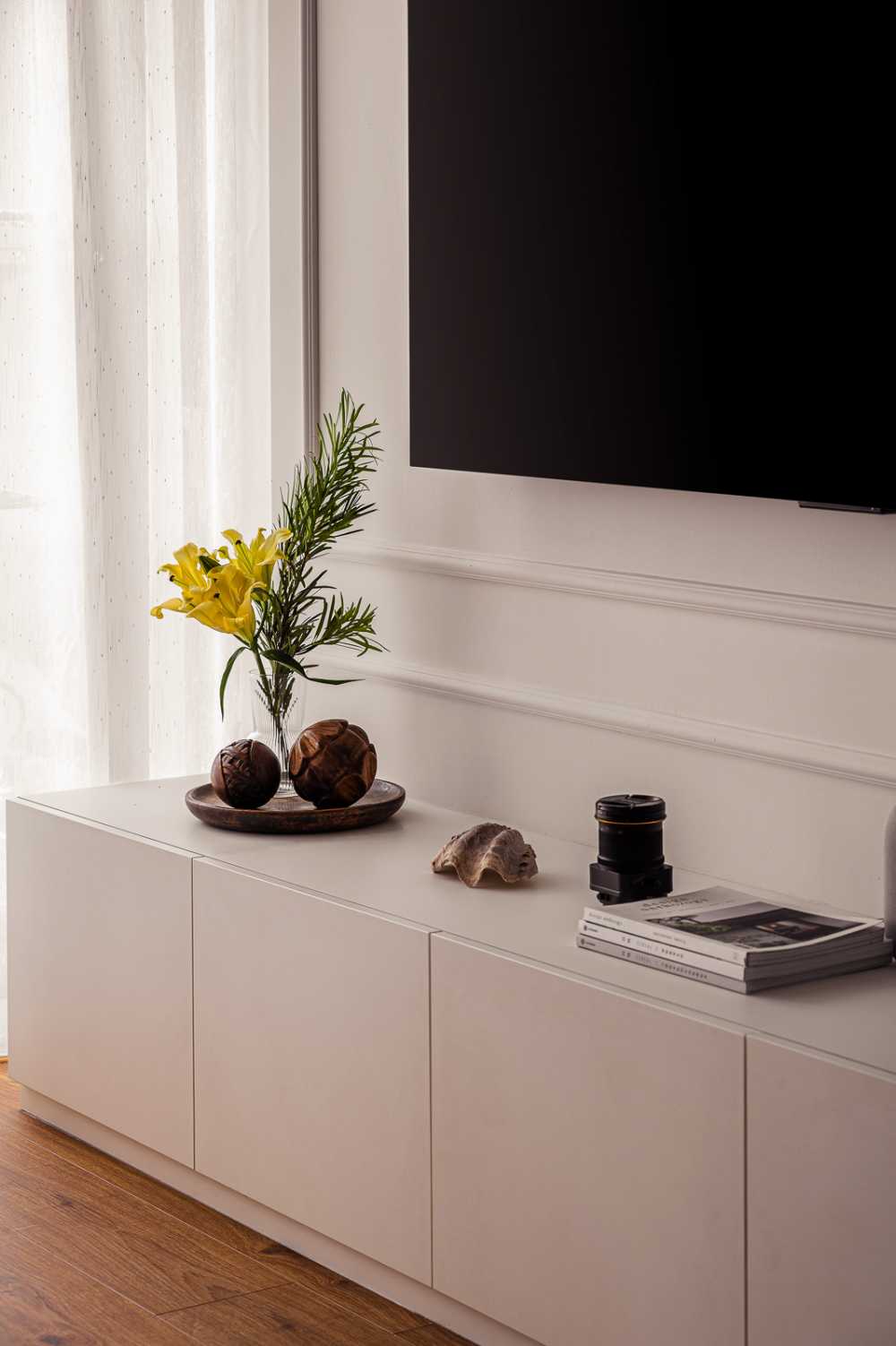 modern living room with tv console and curtain