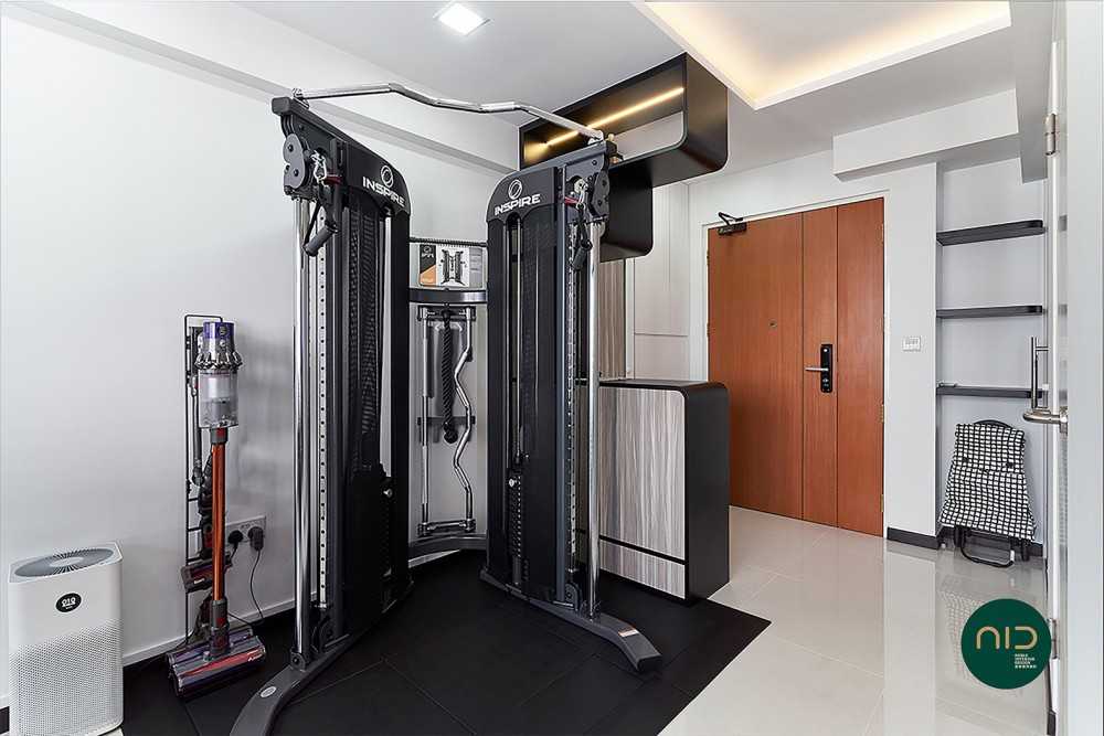 modern home gym with cove lighting and downlights