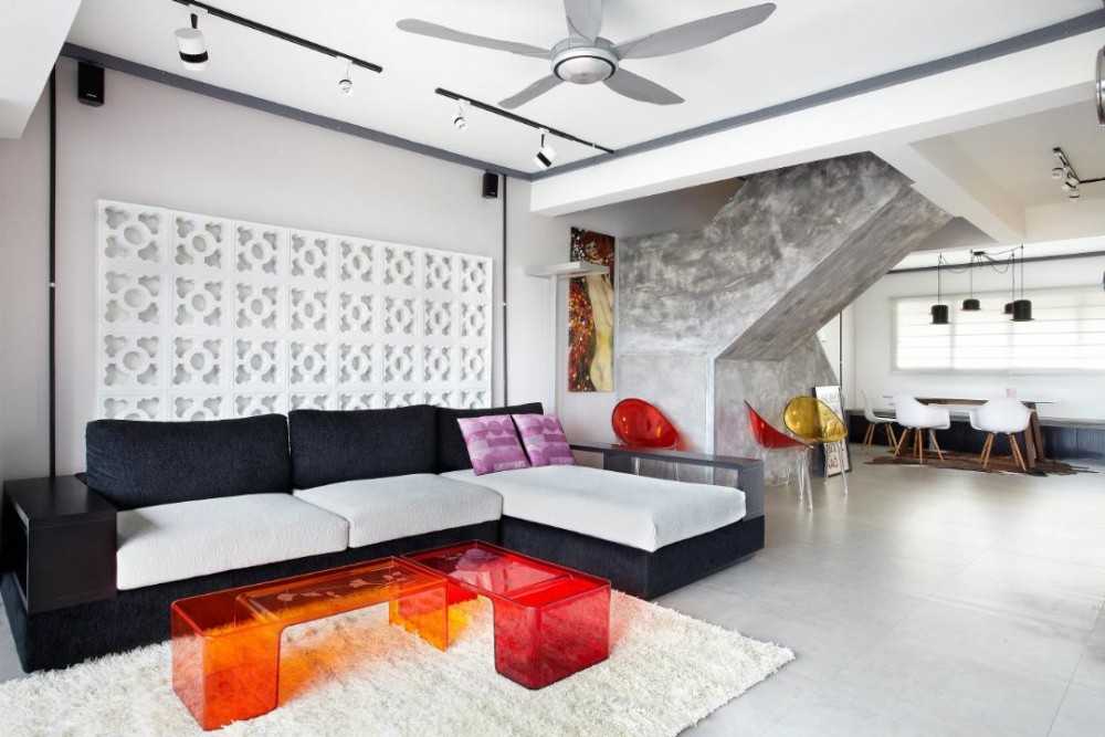 industrial living room with ceiling fan and sofa