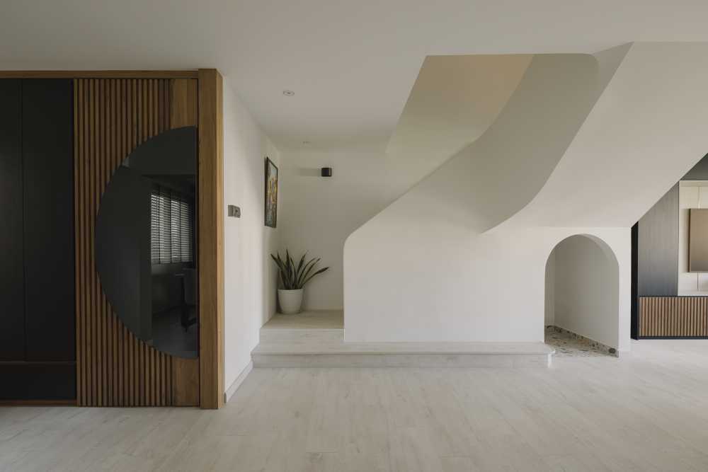 modern entryway with mirror and staircase