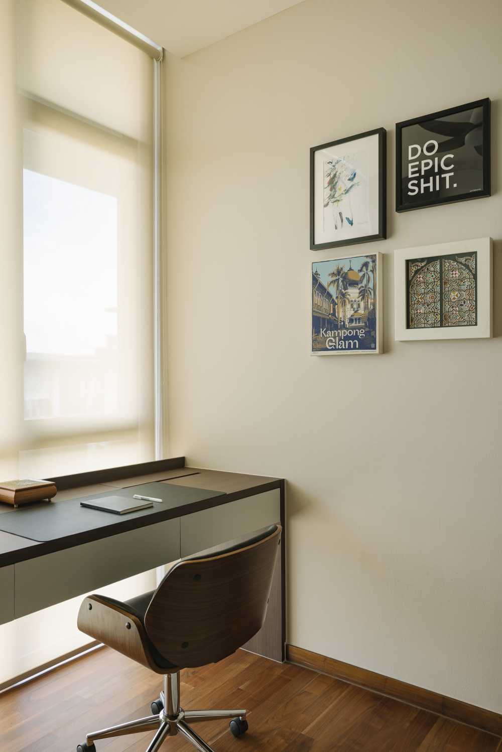 modern home office with artwork and roller blinds