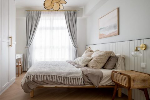 minimalist bedroom with vinyl flooring and feature wall