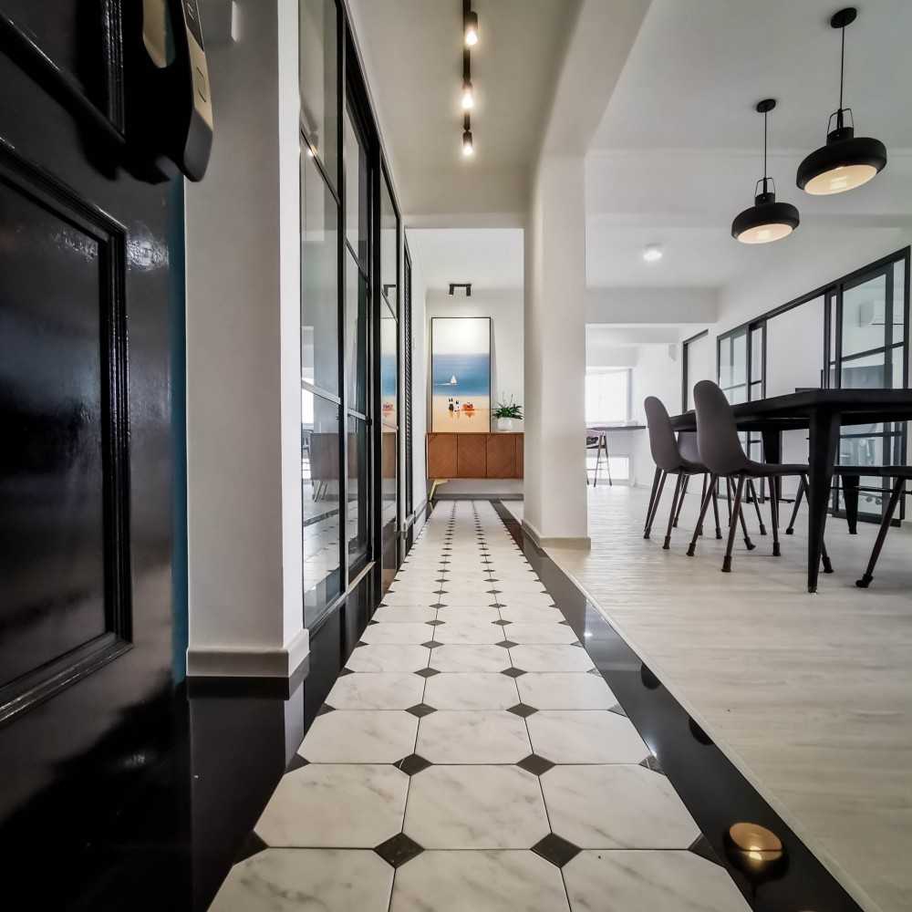 contemporary entryway with artwork and dining chairs