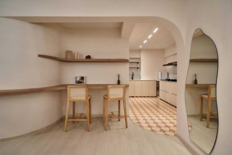 scandinavian living room with bookshelf and vinyl flooring